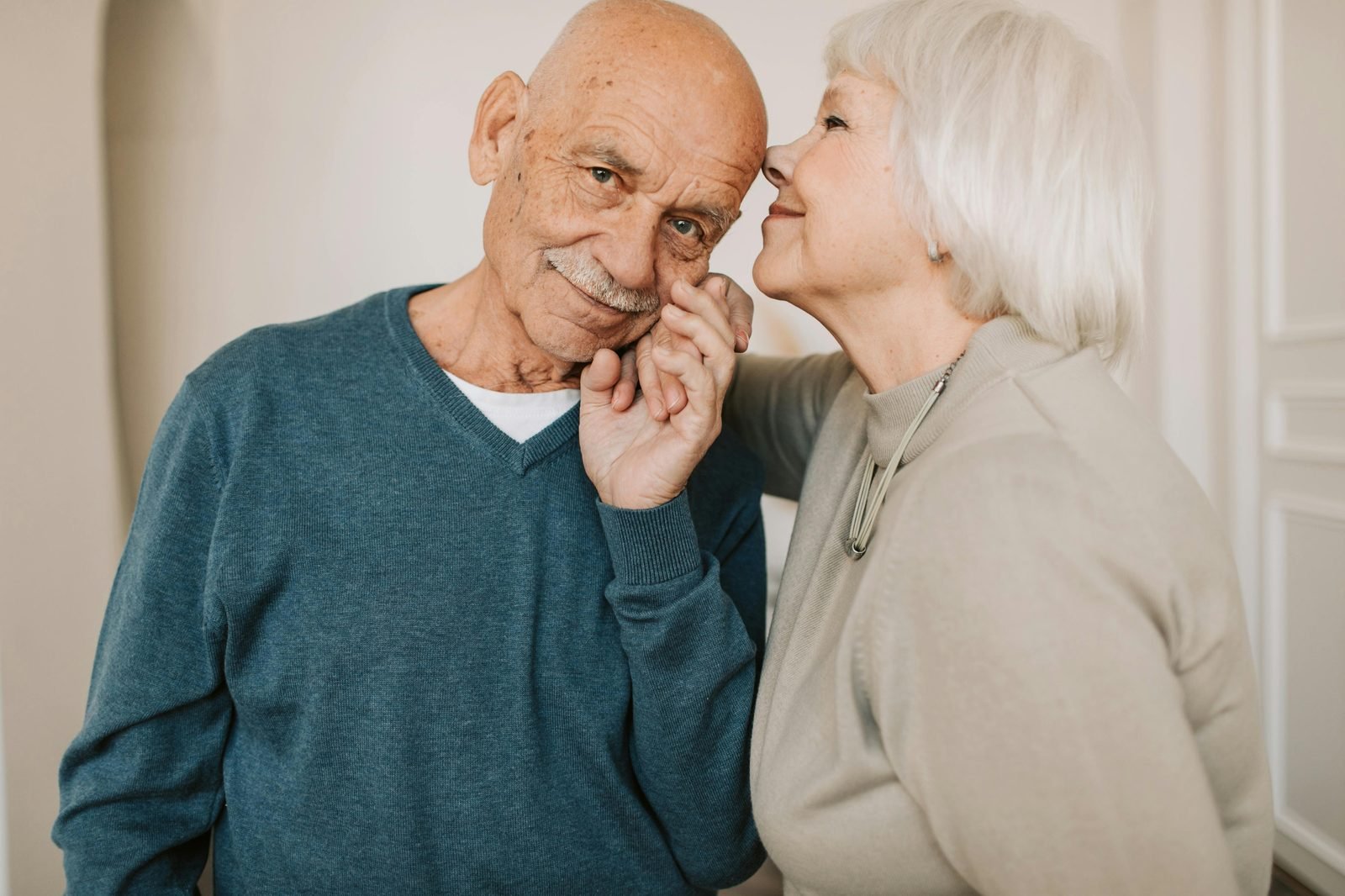 An older couple sharing an affectionate, happy moment together